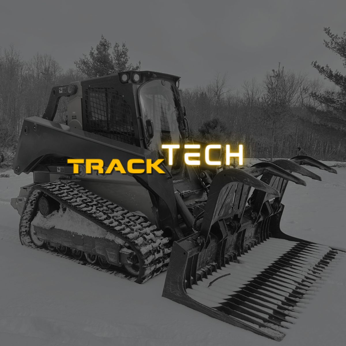 john deere skid steer in a snowy landscape with 'Track Tech' branding.