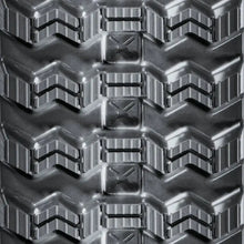 CAT 289C Rubber Tracks with heavy-duty chevron tread pattern and X-shaped traction elements