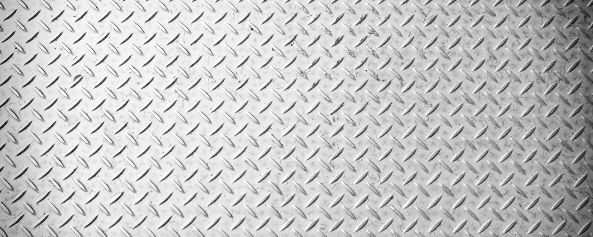 Diamond plate pattern on a metallic surface