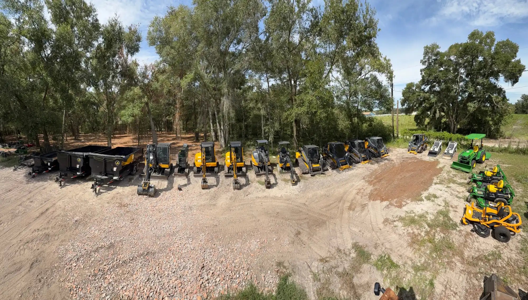 A fleet of heavy construction equipment and lawn care machinery.